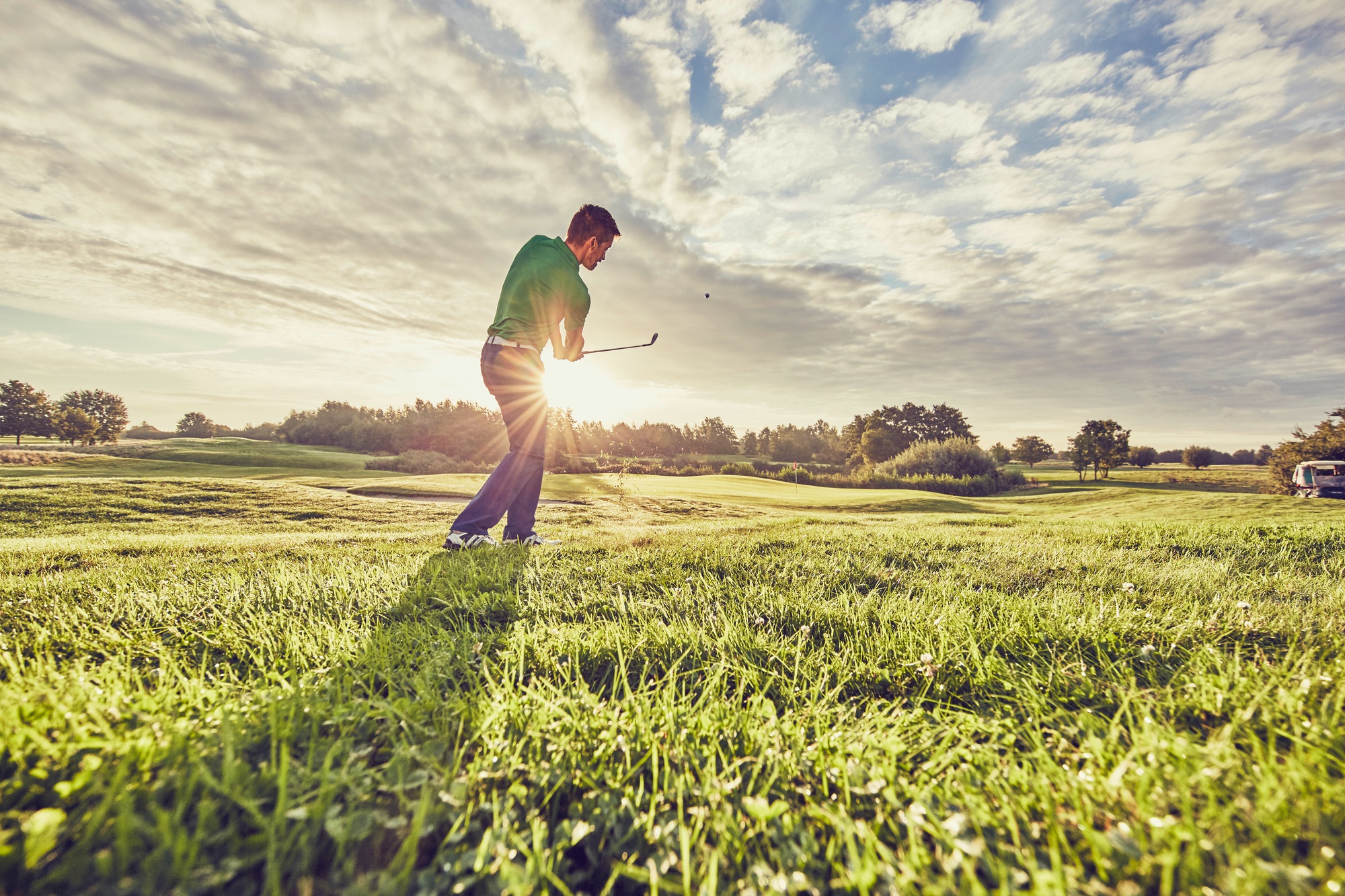 Golfer playing golf on course, Korschenbroich, Dusseldorf, Germany