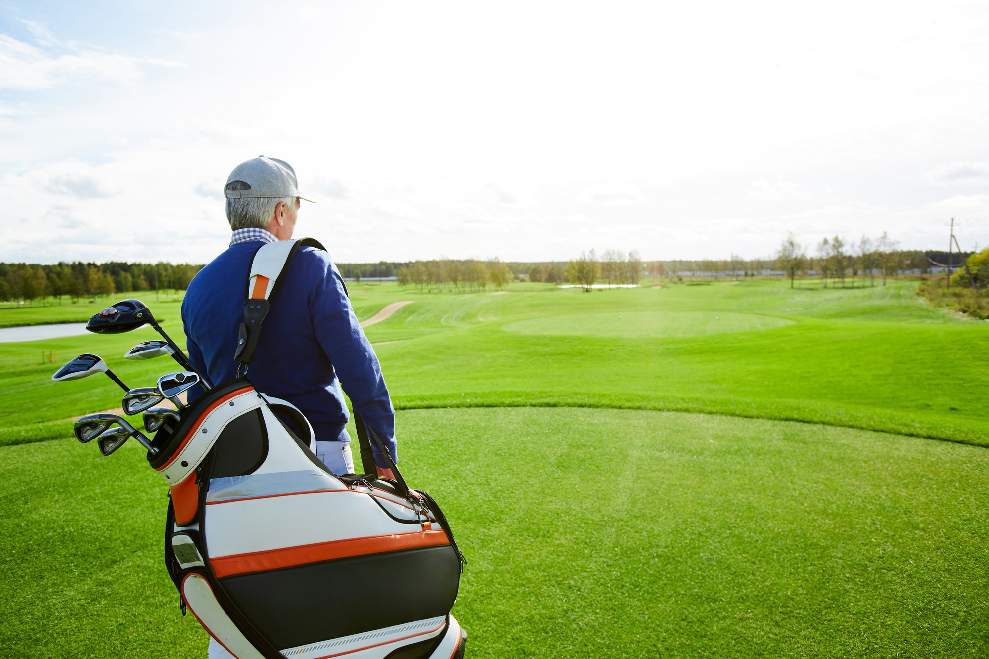 Man with golf clubs